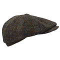 Vue de profil d'une casquette Baker Boy Harris Tweed® au motif tartan marron, beige et bleu.